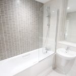 Modern bathroom with bathtub and shower.