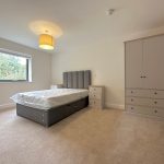 Modern bedroom with bed and wardrobe