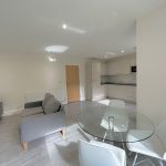 Modern open-plan kitchen and living room interior.