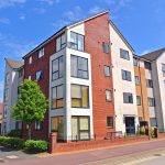 Modern apartment building with brick and white exterior