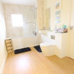 Modern bathroom with bath and toilet