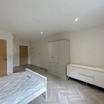 Modern bedroom with wardrobe and dresser