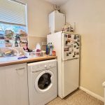 Compact kitchen with washing machine and fridge