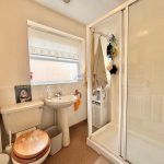 Traditional bathroom with shower and sink