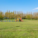 Empty playground on a sunny day in park.