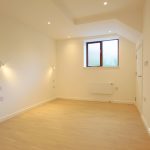 Empty room with wooden floor and window