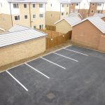 Empty car park near residential houses