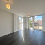 Bright empty room with wooden floor.