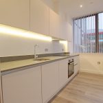 Modern kitchen with sleek design and appliances.