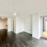 Modern open-plan kitchen and living room interior.