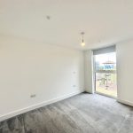 Empty room with carpet and large window