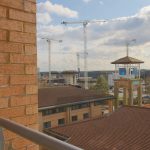 View of construction site and blue sky.
