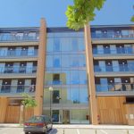 Modern apartment building with glass balconies