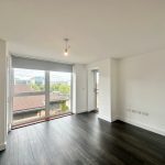 Modern empty room with large window view.