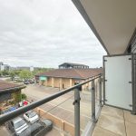 View of car park from modern balcony.