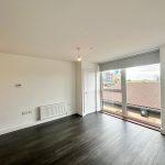 Modern empty room with large window view.