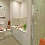 Modern bathroom with shower and bathtub.