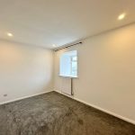 Empty room with carpet and window