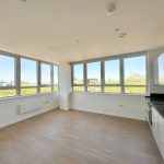 Bright empty kitchen with large windows