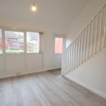Bright room with windows and wooden floor