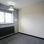 Empty room with stone wallpaper and window.