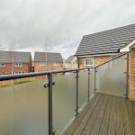 Modern balcony view over residential neighbourhood.