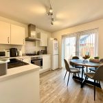 Modern kitchen and dining room with round table
