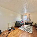 Cosy living room with sofa and wooden floor