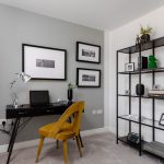 Modern home office with desk and bookshelves