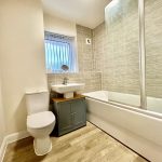 Modern bathroom with toilet and bathtub