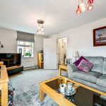 Cosy living room with modern decor and sofa.