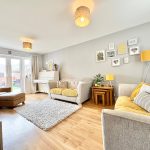 Contemporary living room with sofa and wall art.
