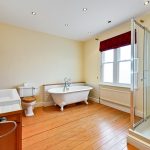 Spacious bathroom with freestanding tub and shower