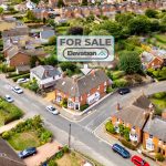 Aerial view of house for sale in neighbourhood.