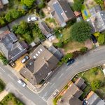Aerial view of suburban houses and roads.