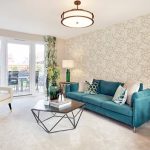 Modern living room with teal sofa and balcony view.