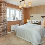 Cosy bedroom with modern decor and soft lighting.