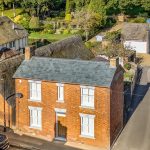 Aerial view of picturesque English village houses.