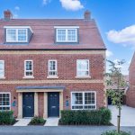 Semi-detached brick houses under clear sky