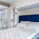 Bedroom with double bed and ensuite shower room