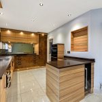 Modern kitchen with wooden cabinetry and island