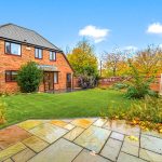 Brick house with garden in autumn