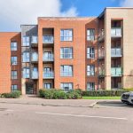 Modern brick apartment building with balconies
