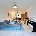 Modern living room with sofa and piano