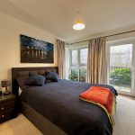 Cosy bedroom with double bed and patio doors