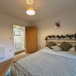Cosy bedroom with double bed and ensuite entrance.