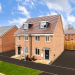 Newly built brick houses with blue sky background.