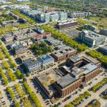 Aerial view of a city with modern buildings.