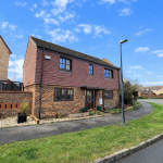 Two-storey brick house on a suburban street