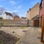 Patio with garden view and wooden fence